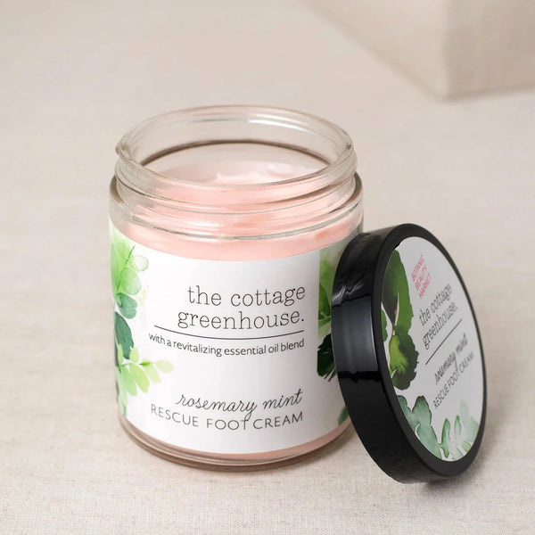 Jar of 'the cottage greenhouse' rosemary mint rescue foot cream on a light background